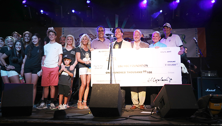 ACF donates check for LSUHealthNO cancer research